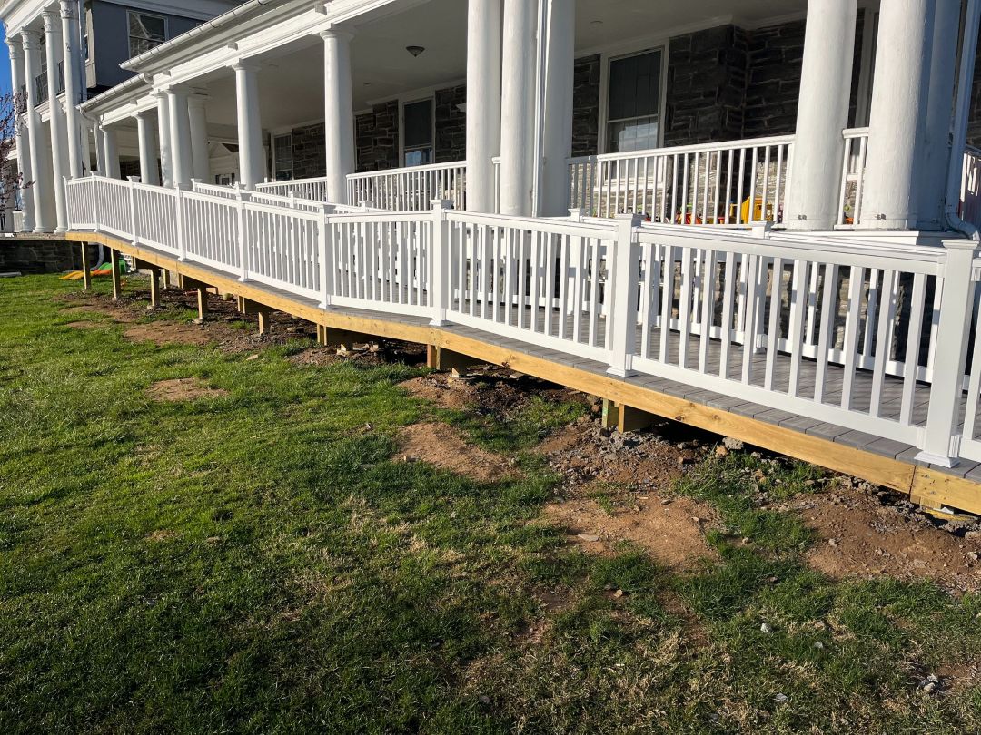 Composite deck access walkway with white railing